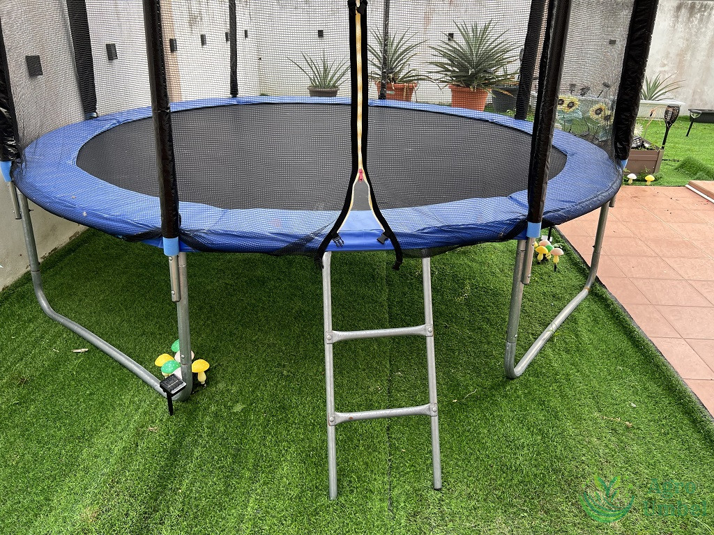 big trampoline on artificial grass